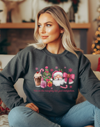Woman wearing a dark gray Christmas-themed sweatshirt with Santa Claus and festive elements.